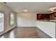 Open-concept living space with hardwood floors and a large window at 5831 Taka Ln, Lithonia, GA 30038