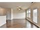 Large open living room with hardwood floors, ceiling fan, and plenty of natural light at 5831 Taka Ln, Lithonia, GA 30038