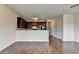 Spacious living area with a kitchen bar, hardwood floors, and neutral paint at 5831 Taka Ln, Lithonia, GA 30038
