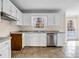 Kitchen boasts white cabinets and stainless steel appliances at 1600 Dillwood Ct, Lithonia, GA 30058