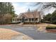 Image of the community clubhouse with ample parking, well-maintained landscaping and paved walkway at 201 Russell Ct, Canton, GA 30115