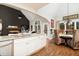 Modern kitchen showcasing granite countertops, stainless appliances, and a view into the living area at 201 Russell Ct, Canton, GA 30115