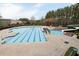 Large community swimming pool with lap lanes, a slide, and a diving board at 201 Russell Ct, Canton, GA 30115