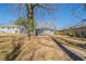 A large backyard is surrounded by privacy fencing and mature trees at 2103 Mcafee Rd, Decatur, GA 30032