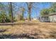 The backyard has a large tree and a wooden deck off of the house at 2103 Mcafee Rd, Decatur, GA 30032
