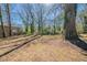 Large backyard with mature trees, offering shade and privacy at 2103 Mcafee Rd, Decatur, GA 30032
