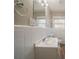 A neutral bathroom with white tiling, updated vanity, and new sink at 2103 Mcafee Rd, Decatur, GA 30032