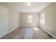 This bedroom features wood-look flooring and lots of natural light at 2103 Mcafee Rd, Decatur, GA 30032