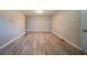 Inviting bedroom with sleek laminate floors, neutral tones, and generous natural light at 2103 Mcafee Rd, Decatur, GA 30032