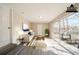 Virtually staged living room featuring lots of natural light and patio access at 2103 Mcafee Rd, Decatur, GA 30032