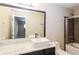 Bathroom featuring shower, bathtub, and sink with white marble countertop at 2229 Bigwood Trl, Atlanta, GA 30349