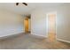 Spacious bedroom with neutral walls and carpet, showcasing an attached walk in closet at 2229 Bigwood Trl, Atlanta, GA 30349