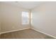 A bright bedroom featuring neutral paint, plush carpeting, and a window that offers natural light at 2229 Bigwood Trl, Atlanta, GA 30349