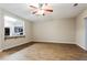 Open living room view into kitchen with breakfast bar and modern appliances at 2229 Bigwood Trl, Atlanta, GA 30349