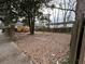 Spacious backyard featuring a wooden deck, mature trees, and plenty of room for outdoor activities and landscaping at 3033 Semmes St, Atlanta, GA 30344