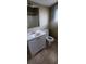 Bathroom featuring a modern vanity and toilet against neutral tiling at 3033 Semmes St, Atlanta, GA 30344