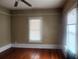 Bedroom featuring hardwood floors, neutral paint and a window with blinds at 3033 Semmes St, Atlanta, GA 30344