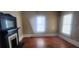 Spacious living room featuring a non-working fireplace and natural light at 3033 Semmes St, Atlanta, GA 30344
