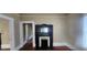 Living room with hardwood floors and a decorative fireplace with ornate black mantle at 3033 Semmes St, Atlanta, GA 30344