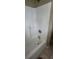 Bathroom shower with a white tub and chrome fixtures at 3033 Semmes St, Atlanta, GA 30344