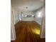Spacious living room with hardwood floors, neutral walls and a large window for natural light at 7205 Lakeview Dr, Covington, GA 30014