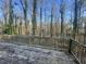 Wooden back deck overlooks a serene wooded area, offering a peaceful retreat for enjoying nature and quiet moments at 1600 Whisperwood Trl, Stone Mountain, GA 30088