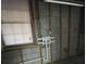 Unfinished basement with a window and exposed utilities at 1600 Whisperwood Trl, Stone Mountain, GA 30088