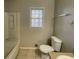 Standard bathroom features a tiled floor, shower and tub combination, toilet and vanity at 1600 Whisperwood Trl, Stone Mountain, GA 30088