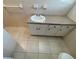 Bathroom featuring tile flooring, vanity with storage, and a white sink at 1600 Whisperwood Trl, Stone Mountain, GA 30088