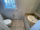 Cozy bathroom with a modern sink and window with natural light at 1600 Whisperwood Trl, Stone Mountain, GA 30088