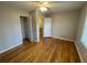 A bright bedroom featuring hardwood floors, a ceiling fan and a window at 1600 Whisperwood Trl, Stone Mountain, GA 30088