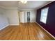 This bedroom offers hardwood floors, window and access to an ensuite bathroom at 1600 Whisperwood Trl, Stone Mountain, GA 30088