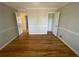 Spacious bedroom with a large closet, hardwood floors, and access to an ensuite bathroom at 1600 Whisperwood Trl, Stone Mountain, GA 30088