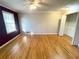 Bedroom featuring hardwood floors, a window, and a closet for storage at 1600 Whisperwood Trl, Stone Mountain, GA 30088