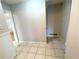 Hallway featuring neutral paint, tile flooring, and closet at 1600 Whisperwood Trl, Stone Mountain, GA 30088