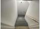 Stairway with gray stairs and a white handrail at 1600 Whisperwood Trl, Stone Mountain, GA 30088