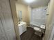 Full bathroom with a tub and shower combination, white vanity, and a large mirror at 980 Linam Se Ave, Atlanta, GA 30315