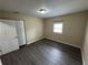 Simple bedroom with hardwood floors, natural light and closet at 980 Linam Se Ave, Atlanta, GA 30315