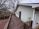 A medium, stained wood deck is attached to the side of this house at 980 Linam Se Ave, Atlanta, GA 30315