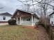 Showing the exterior of a cozy home with green siding and a white porch at 980 Linam Se Ave, Atlanta, GA 30315