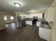 Bright kitchen with stainless steel appliances, granite countertops and white cabinets at 980 Linam Se Ave, Atlanta, GA 30315