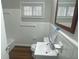 Clean bathroom with white tiled walls, a bathtub, and wood flooring at 1864 Cindy Dr, Decatur, GA 30032