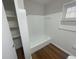 Bathroom featuring a tub, linen closet and wood flooring at 1864 Cindy Dr, Decatur, GA 30032