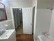 Bathroom with tub, sink, and access to hallway at 1864 Cindy Dr, Decatur, GA 30032