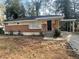 Brick ranch house with carport and landscaped yard at 1864 Cindy Dr, Decatur, GA 30032