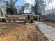 Brick ranch house with carport and landscaped yard at 1864 Cindy Dr, Decatur, GA 30032