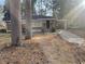 Brick ranch house with carport and mature trees in the front yard at 1864 Cindy Dr, Decatur, GA 30032