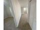 Bright hallway with carpet and access to bedrooms at 1864 Cindy Dr, Decatur, GA 30032