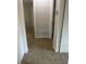 Clean hallway with neutral colored carpet and access to other rooms at 1864 Cindy Dr, Decatur, GA 30032