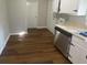 Kitchen boasts wood flooring and white cabinetry at 1864 Cindy Dr, Decatur, GA 30032